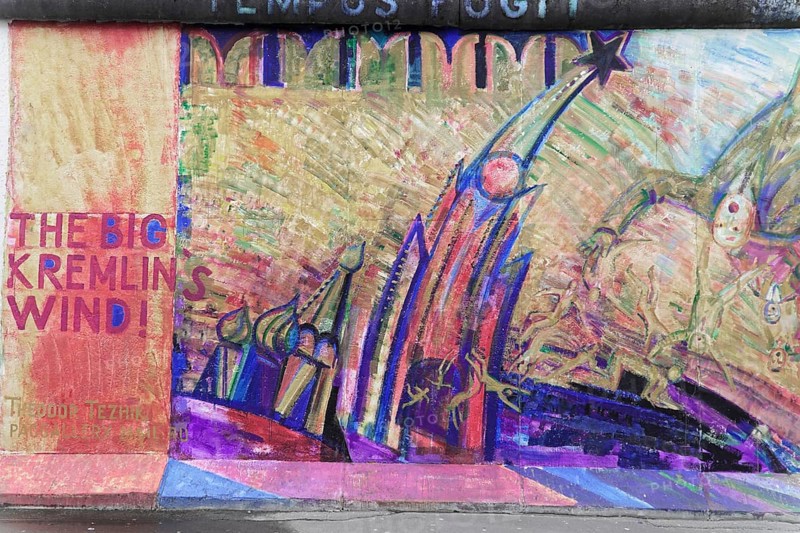 Graffiti on the Berlin Wall in the East Side Gallery, Berlin, Germany, Europe, Colourful graffiti with a surreal building and critical texts, East Side Gallery, Warschauer Strasse, Europe