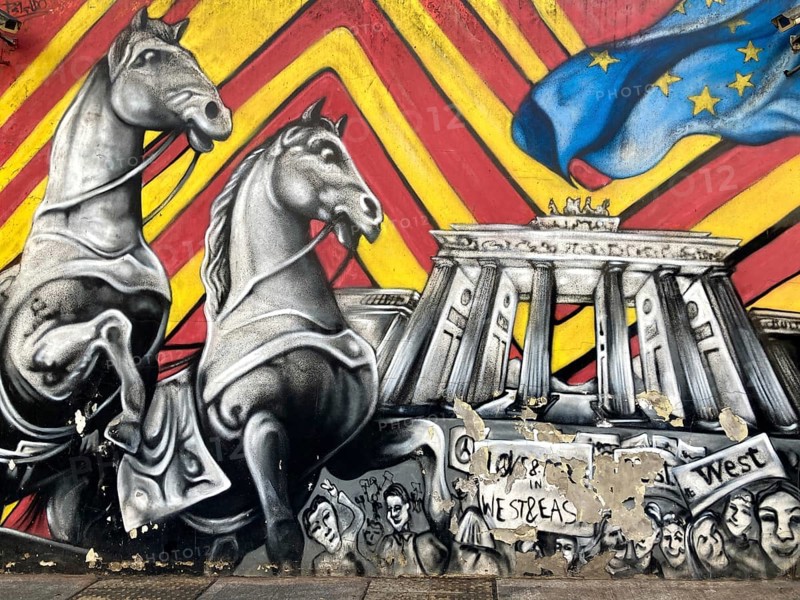 Street art shows the Brandenburg Tor with horses on the outer wall of the German Embassy in Buenos Aires, Argentina, South America