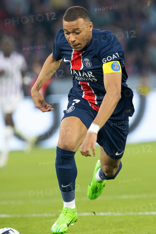 Football match, captain Kylian MBAPPE' Paris St Germain energetically running after and leading the ball, Parc des Princes football stadium, Paris, France, Europe