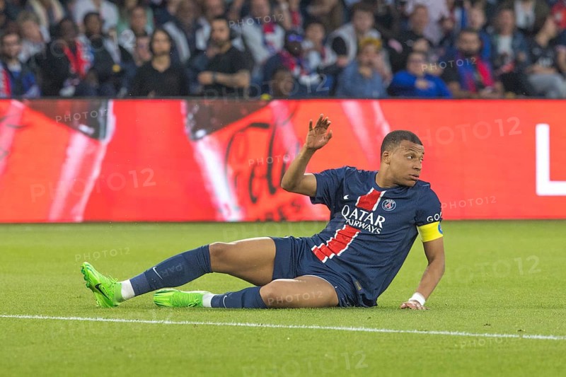Football match, captain Kylian MBAPPE' Paris St Germain has just been fouled and is lying on the ground complaining, Parc des Princes football stadium, Paris, France, Europe
