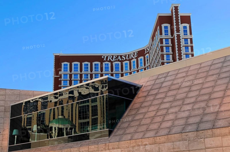 Las Vegas, Nevada, USA, North America, Treasure Island Hotel in Las Vegas with reflective windows, staggered architecture and clean lines against a blue sky, Las Vegas Strip, North America