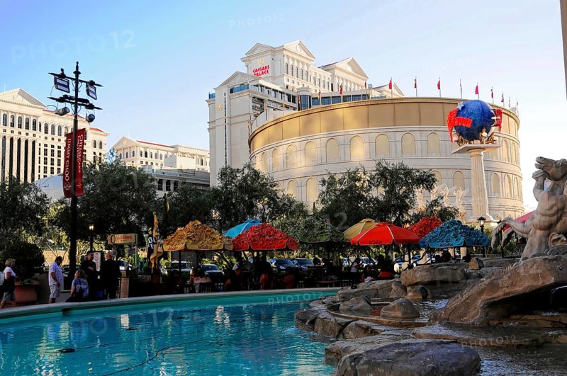Las Vegas, Nevada, USA, North America, Exterior view of a hotel and casino with pool, colourful umbrellas and people, Las Vegas Strip, North America
