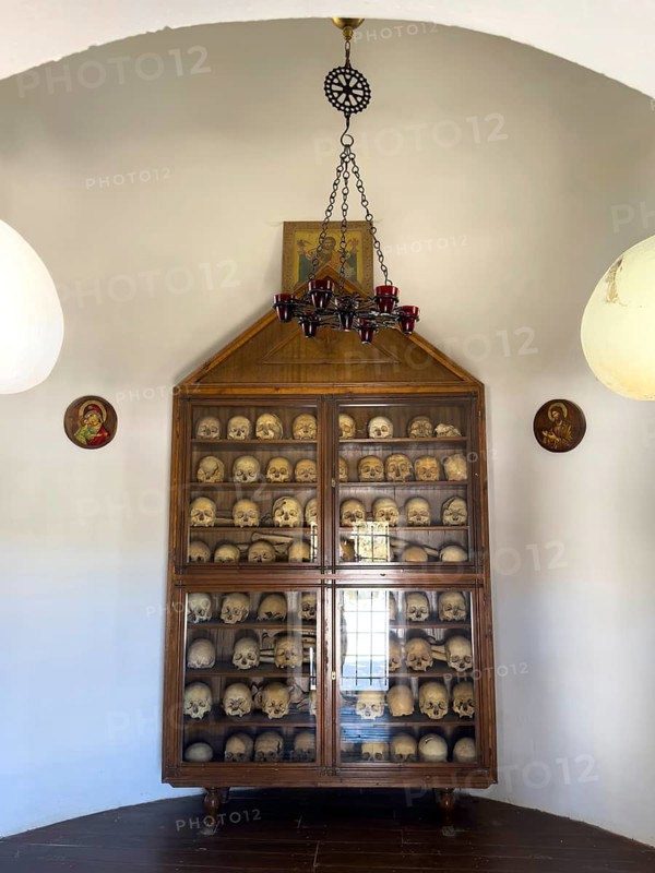 Historic ossuary with cabinet Showcase with old skulls skeletonised heads of monks from UNESCO World Heritage Site historic orthodox monastery Moni Arkadi Arkadi monastery from early Middle Ages, important national monument national shrine on the island of Crete, Arkadi, Armnatos, Crete, Greece, Europe