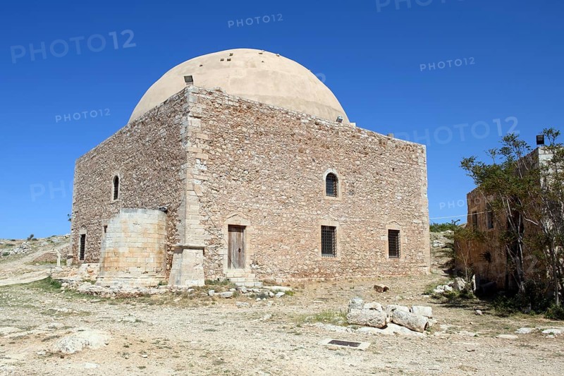 Dome of the former Sultan Ibrahim Mosque built in 1646 after the Ottoman conquest of Crete on the former site of the Venetian bishop's church of San Nicolo in the ruins of the historic fortress Fortetza Fortezza of Rethymno built by the Republic of Venice in the 16th century in the north-west of the old town of Rethymno on the rocky hill of Paleokastro on the north coast of the island of Crete, Rethymno, Crete, Greece, Europe