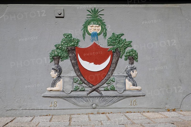 Detail of St George's Fountain, date and images on the octagonal cast iron trough from 1816, reclining crescent moon, sphinx-like fantasy creatures, wine, reference to the historical water supply, Boennigheim, Ludwigsburg district, Baden-Wuerttemberg, Germany, Europe