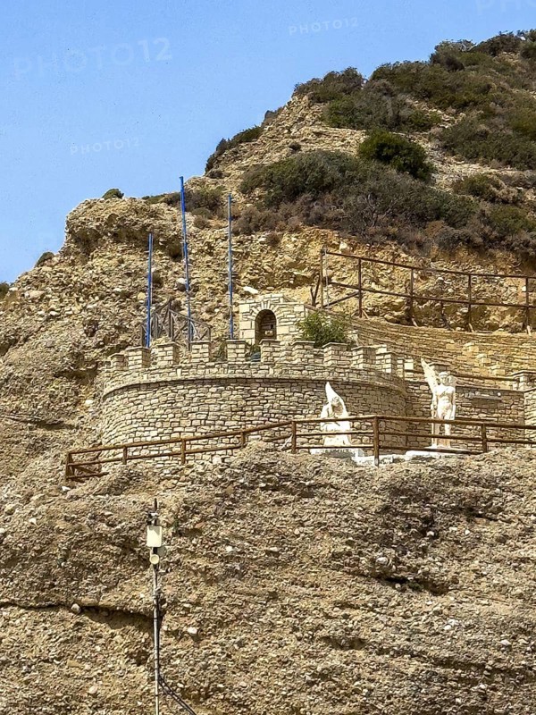 View of rock with hiding place of monument to Daedalus and Icarus on cliff of flight for flight from Crete of figures statues legendary figures of Greek mythology, Agia Galini, Crete, Greece, Europe