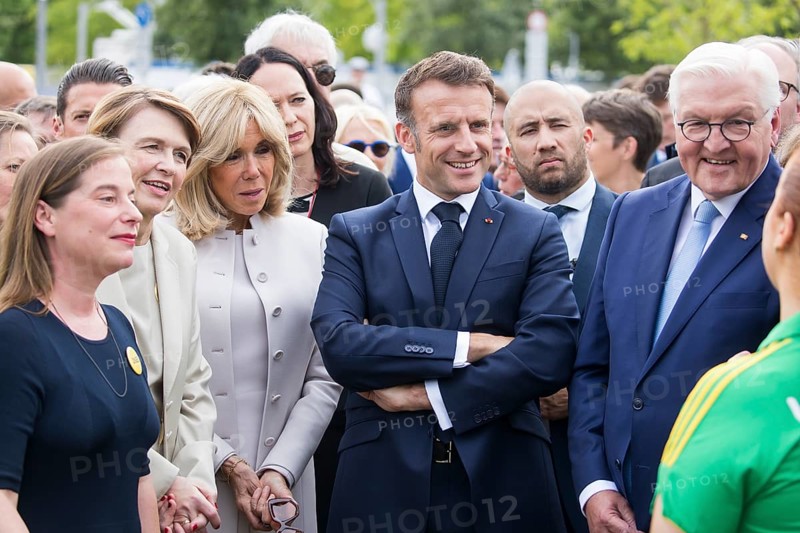 Elke Buedenbender (woman of Frank-Walter Steinmeier), Brigitte Trogneux (woman of Emmanuel Macron), Emmanuel Macron (President of the French Republic) and Frank-Walter Steinmeier (President of the Federal Republic of Germany) play table football during a tour of the Citizens' Festival celebrating democracy. / The Basic Law turns 75, together it will be a celebration, Berlin, 26.05.2024