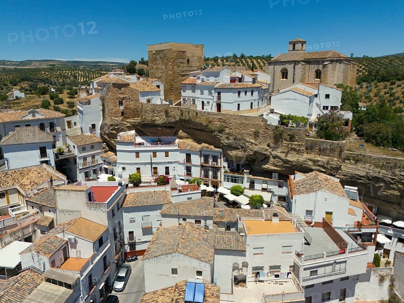 Aerial view of a Spanish village with white buildings, historic buildings, churches and olive groves in a Mediterranean landscape, aerial view, cave dwellings, Setenil de las Bodegas, Cadiz, Andalusia, Spain, Europe