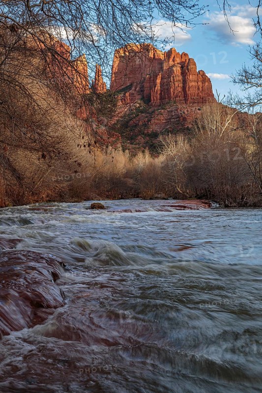 Cathedral Rock sandstone formations tower over Oak Creek at the Crescent Moon Picnic Site in Sedona, Arizona, USA, North America