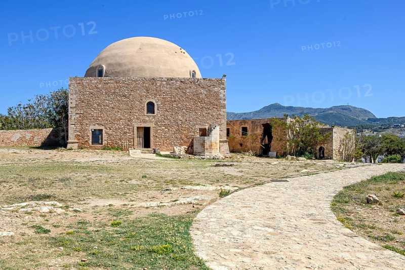 Ruins of domed former Sultan Ibrahim Mosque built in 1646 after Ottoman conquest of Crete on former site of Venetian Episcopal Church of San Nicolo in ruins of historic fortress Fortetza Fortezza of Rethymno built by Republic of Venice in 16th century in northwest of old town of Rethymno on rocky hill Paleokastro on north coast of island of Crete, Rethymno, Crete, Greece, Europe