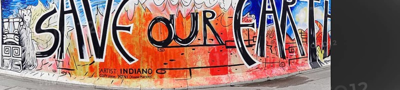 Graffiti on the Berlin Wall at the East Side Gallery, Berlin, Germany, Europe, A colourful graffiti showing the text 'SAVE OUR EARTH' on a wall with mostly orange and blue colours, East Side Gallery, Warschauer Strasse, Europe