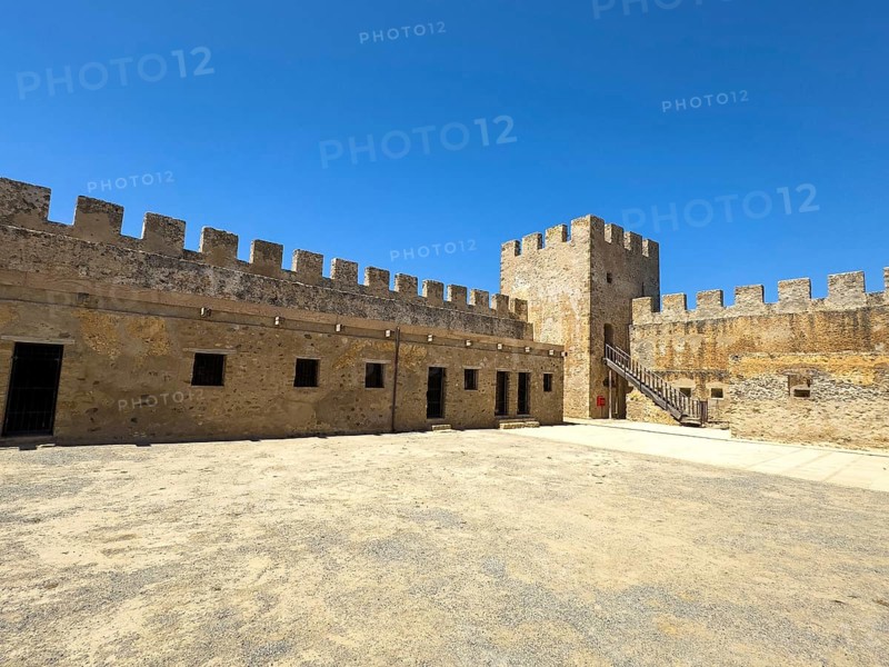 View of the inner courtyard of Fort Fortezza Fortetza Frangokastello, Venetian fort built by the Republic of Venice in the 14th century with walls and crenellated corner tower, Frangokastello, Sfakia, Crete, Greece, Europe