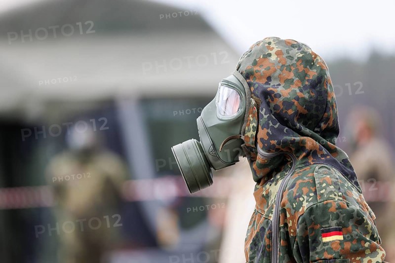 German soldiers from an NBC defence unit in protective clothing practise decontamination during the NATO Steadfast Defender large-scale manoeuvre in Pabrade, 29.05.2024