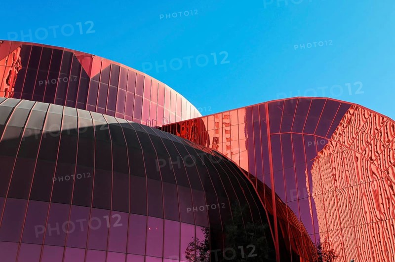 Las Vegas, Nevada, USA, North America, Building with red, wavy glass facade and reflections under blue sky, Las Vegas Strip, North America