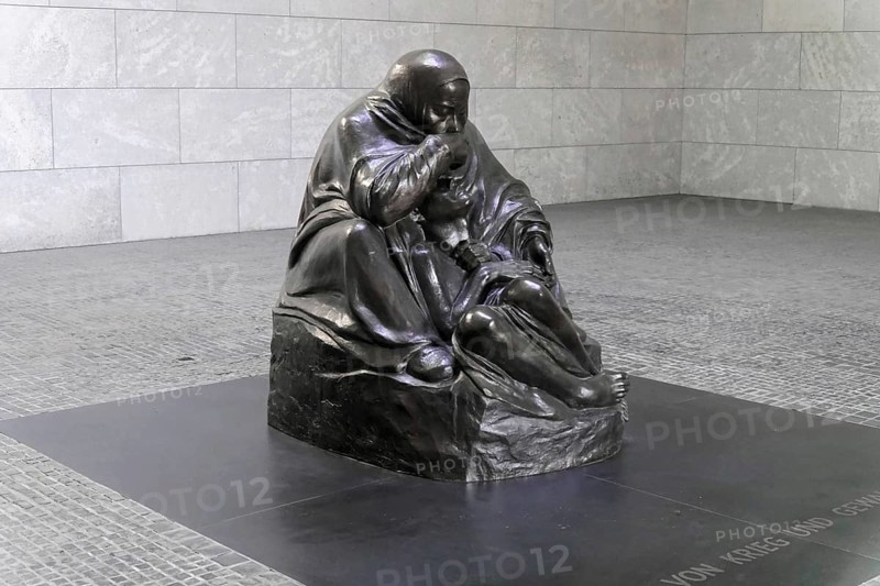 Pieta by Kaethe Kollwitz in the Schinkelbau Neue Wache unter den Linden in Berlin, Berlin, Germany, Europe, Sad sculpture of a mother with her child displayed on a grey square, Europe