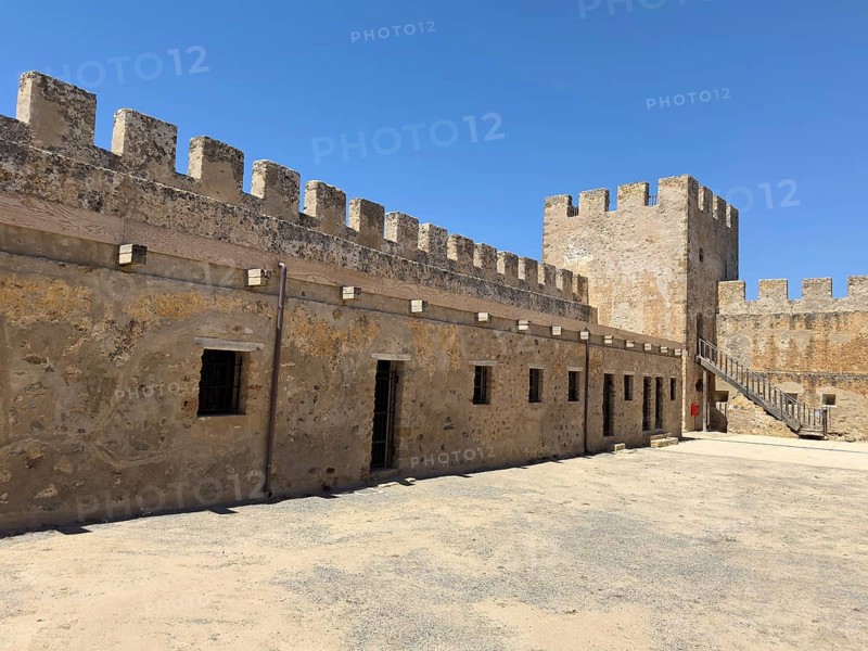 View of the inner courtyard of Fort Fortezza Fortetza Frangokastello, Venetian fort built by the Republic of Venice in the 14th century with walls and crenellated corner tower, Frangokastello, Sfakia, Crete, Greece, Europe