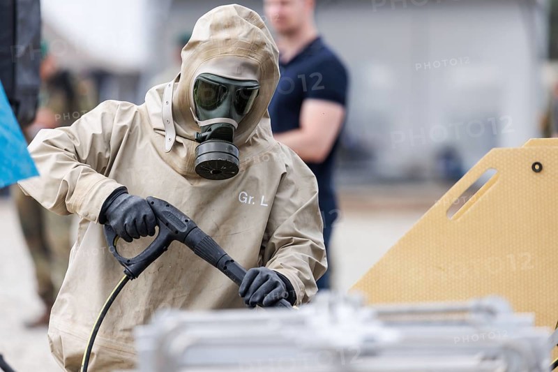 German soldiers from an NBC defence unit in protective clothing practise decontamination during the NATO Steadfast Defender large-scale manoeuvre in Pabrade, 29.05.2024