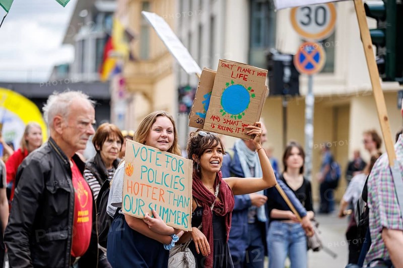Demonstrators with signs at Fridays for Future, taken during the climate strike for the EU elections in Berlin, 31/05/2024