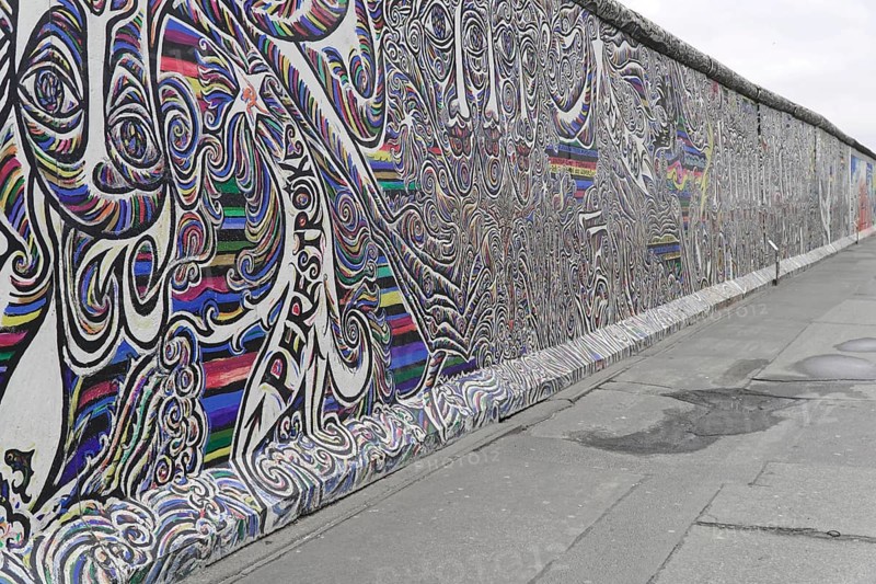 Graffiti on the Berlin Wall in the East Side Gallery, Berlin, Germany, Europe, Abstract, dynamic graffiti with colourful lines and shapes depicting a living movement, East Side Gallery, Warschauer Strasse, Europe