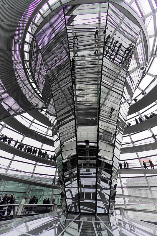 The dome of the Reichstag in Berlin. The architect Sir Norman Foster designed the steel and glass structure. Berlin, Berlin, Germany, Europe, people walk through a futuristic glass construction in which violet light reflections dominate, The dome of the Berlin Reichstag. Berlin, Europe