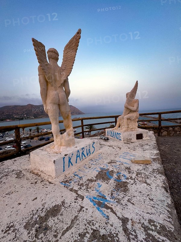 Photo taken at dusk evening mood of monument to Daedalus and Icarus on cliff of flight for flight from Crete of figures statues legendary figures of Greek mythology, in the background Libyan Sea Mediterranean, Agia Galini, Crete, Greece, Europe