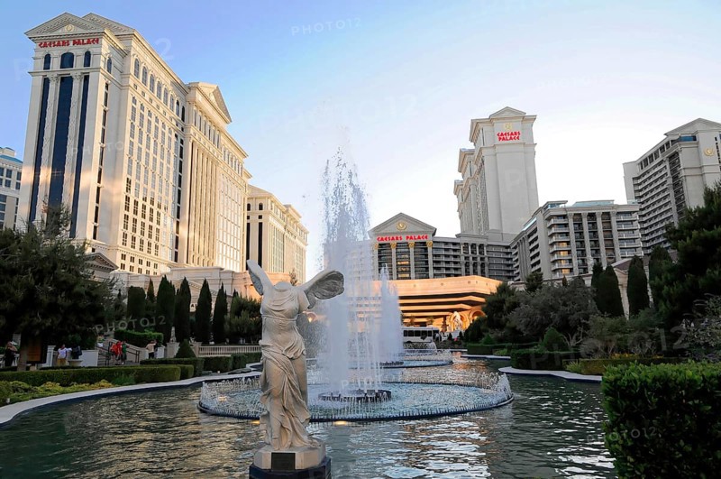 Las Vegas, Nevada, USA, North America, Impressive buildings and a large fountain illuminated by the evening sun, Las Vegas Strip, North America