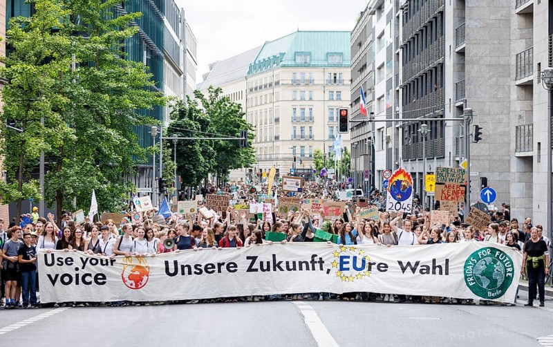 Demonstrators with signs at Fridays for Future, taken during the climate strike for the EU elections in Berlin, 31/05/2024