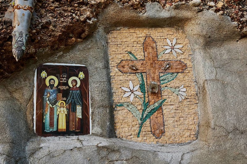 Rock Chapel, Archangel Michael Panormitits, Two religious mosaics on one wall, one shows a cross with flowers, the other orthodox icons, Old Town of Rhodes, Rhodes Town, Rhodes, Dodecanese, Greek Islands, Greece, Europe