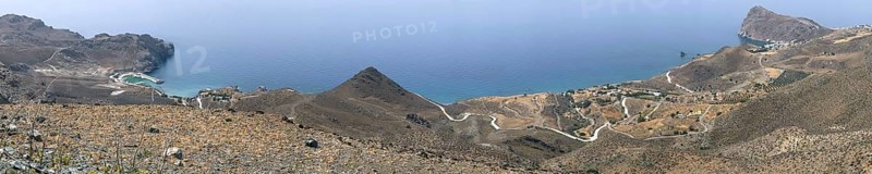 Panoramic view from elevated position on left Loutra with new small harbour on right small village Lentas Lendas at the foot of Asterousia Mountains next to Cape Leontas with rock called weeping lion on south coast of island Crete on Libyan Sea Mediterranean, Loutra, Lentas, Crete, Greece, Europe