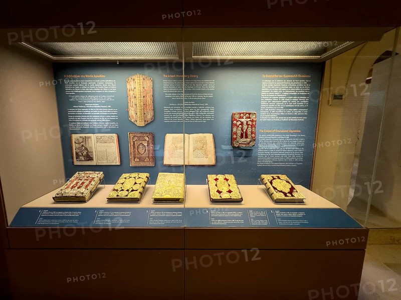 Showcase in museum Monastery museum with antique books partly from historical former copying workshop of monks in UNESCO World Heritage Site orthodox monastery Moni Arkadi Arkadi monastery from early Middle Ages, important national monument national shrine on the island of Crete, Arkadi, Armnatos, Crete, Greece, Europe
