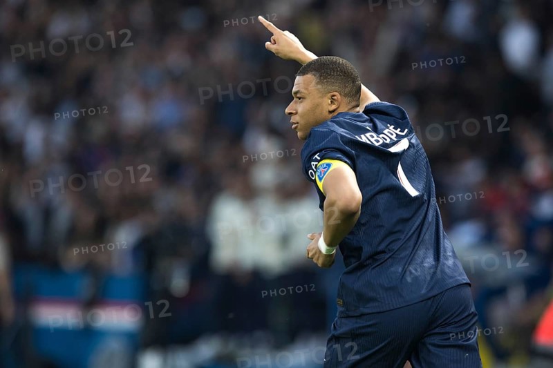 Football match, captain Kylian Mbappe' Paris St Germain has just scored 1-0 for Paris St Germain, right finger up signalling his goal, captain's armband, Parc des Princes football stadium, Paris, France, Europe
