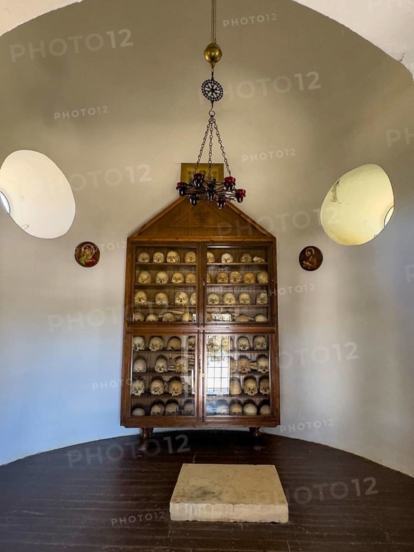 Historic ossuary with cabinet Showcase with old skulls skeletonised heads of monks from UNESCO World Heritage Site historic orthodox monastery Moni Arkadi Arkadi monastery from early Middle Ages, important national monument national shrine on the island of Crete, Arkadi, Armnatos, Crete, Greece, Europe