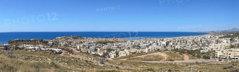 Panoramic photo overview from elevated position on the city of Rethymno left behind fortress fortress of Rethymno, behind Aegean Cretan Sea Aegean Sea Mediterranean, Crete, Greece, Europe