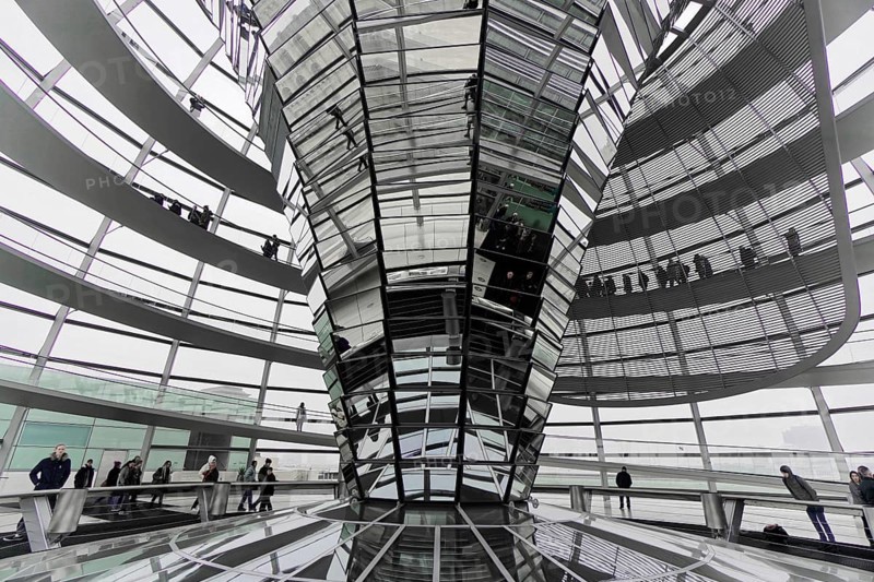 The dome of the Reichstag in Berlin. The architect Sir Norman Foster designed the steel and glass structure. Berlin, Berlin, Germany, Europe, Futuristic interior architecture made of glass and steel, with paved walkways on different levels, The dome of the Berlin Reichstag. Berlin, Europe