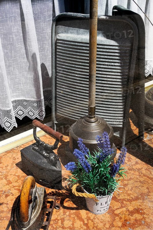 Shop window of a laundry with washboard, old iron and laundry tamper, Kempten, Allgaeu, Bavaria, Germany, Europe