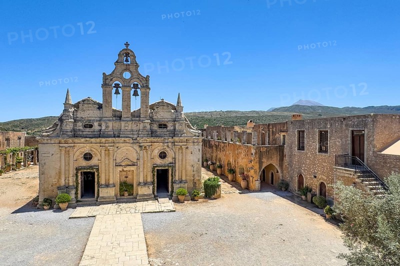 View from upper archway into building from 1870 built on site of west gate destroyed during siege of Ottoman Empire Ottoman Monastery Church Transfiguration Church dedicated to Saints Constantine and Helen and Transfiguration of Christ the Saviour built from 1587 to 1600 in historic monastery Arkadi vin UNESCO World Heritage Site Orthodox Monastery Moni Arkadi Arkadi Monastery from early Middle Ages, important national monument national shrine on island of Crete, Arkadi, Armnatos, Crete, Greece, Europe