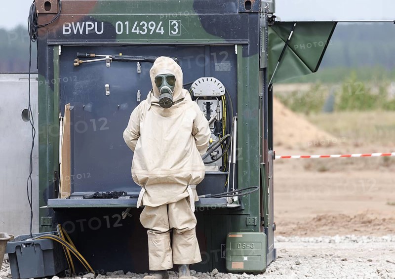 German soldiers from an NBC defence unit in protective clothing practise decontamination during the NATO Steadfast Defender large-scale manoeuvre in Pabrade, 29.05.2024