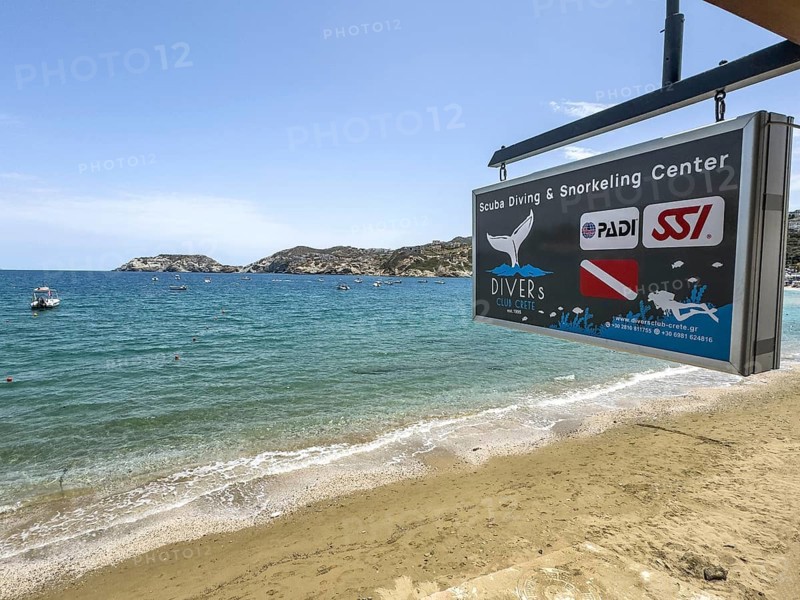 Sign of diving centre base diving school for recreational divers on beach of holiday resort Agia Pelagia out on Aegean Sea Aegean Mediterranean Sea off north coast of Crete island, Agia Pelagia, Crete, Greece, Europe