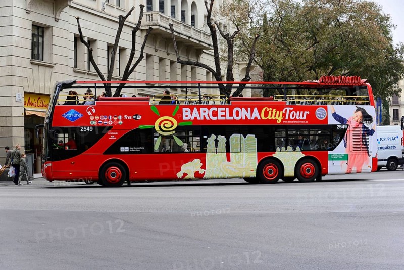 Barcelona, Catalonia, Spain, Europe, A red double-decker bus with the inscription 'Barcelona City Tour' on a street, Europe