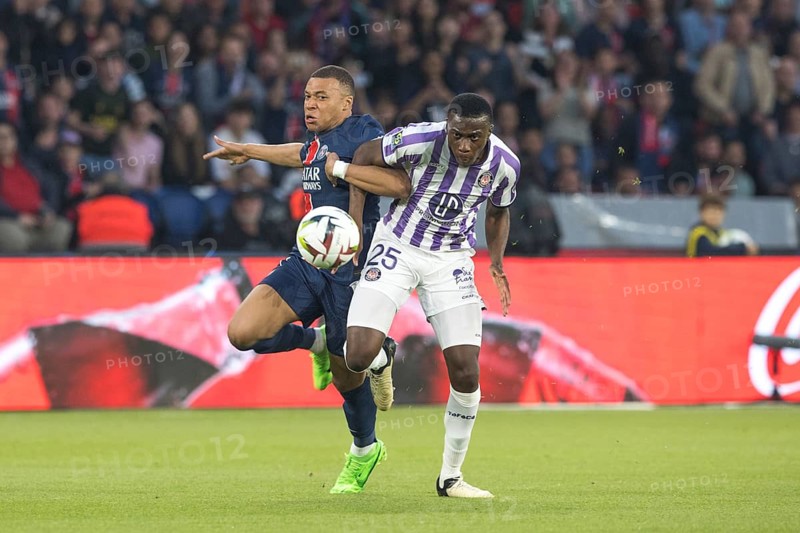 Football match, captain Kylian MBAPPE' Paris St. Germain left in a duel for the ball with Kevin KEBEN FC Toulouse, Parc des Princes football stadium, Paris, France, Europe