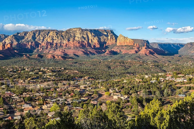 The town of Sedona, Arizona in a valley surrounded by red limestone rock formations, USA, North America