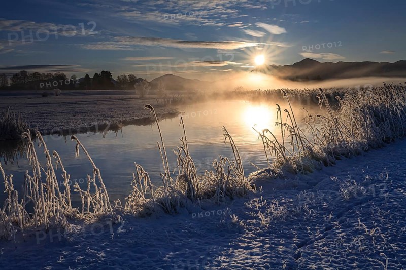 River at sunrise in front of mountains, winter, Ach estuary, Uffing, Alpine foothills, Upper Bavaria, Bavaria, Germany, Europe