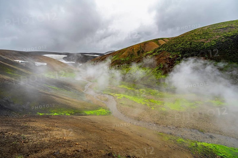Colourful volcanic landscape with hills and snow, volcanic steaming hot springs, Laugavegur trekking trail, Landmannalaugar, Fjallabak Nature Reserve, Icelandic Highlands, Sudurland, Iceland, Europe