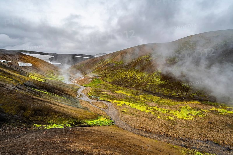 Colourful volcanic landscape with hills and snow, volcanic steaming hot springs, Laugavegur trekking trail, Landmannalaugar, Fjallabak Nature Reserve, Icelandic Highlands, Sudurland, Iceland, Europe