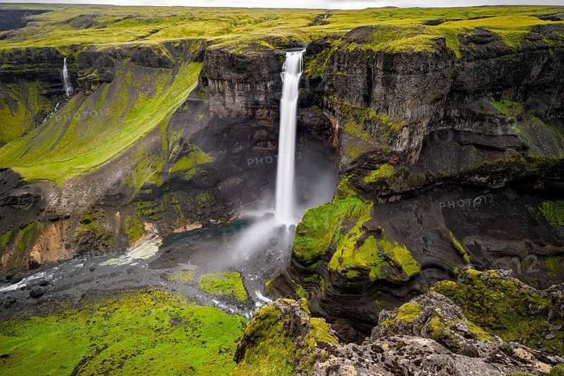 River and waterfalls at a canyon with green moss, Haifoss and Granni waterfall at a canyon, Fossá í Thjórsárdal, with river í Thjórsárdal, long exposure, dramatic landscape, Hekla, Iceland, Europe