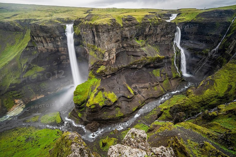 River and waterfalls at a canyon with green moss, Haifoss and Granni waterfall at a canyon, Fossá í Thjórsárdal, with river í Thjórsárdal, long exposure, dramatic landscape, Hekla, Iceland, Europe