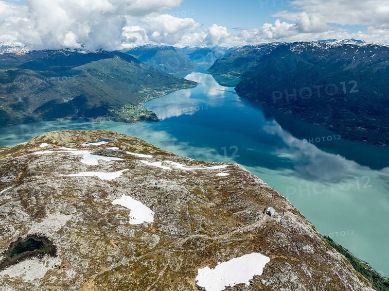 Lustrafjord, branch of Sognefjord, view towards east end to Fortun and Skjolden, hut of a weather station, summit of mountain Molden, aerial view, Norway, Europe