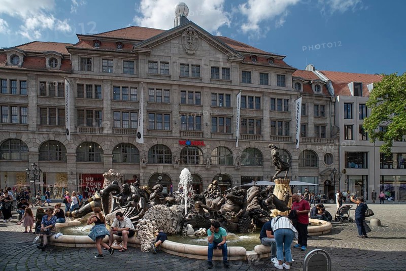 Fountain the marriage carousel, designed after a poem by Hans Sachs, designed by the sculptor Jürgen Weber and built in 1984, behind the Weisser Turm department stores', Nuremberg, Middle Franconia, Bavaria, Germany, Europe