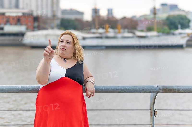 Plus size woman saying no with her hand. Stop concept. Rejection concept. Non-approval concept