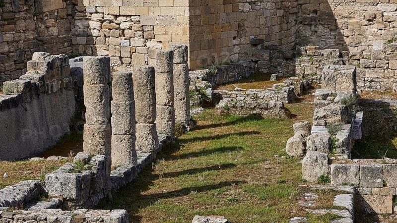 Close-up of ancient stone columns and walls overgrown with grass, part of an archaeological site, Kamiros, Archaeological site, Ancient city, Foundation of Doric Greeks, Rhodes, Dodecanese, Greek Islands, Greece, Europe
